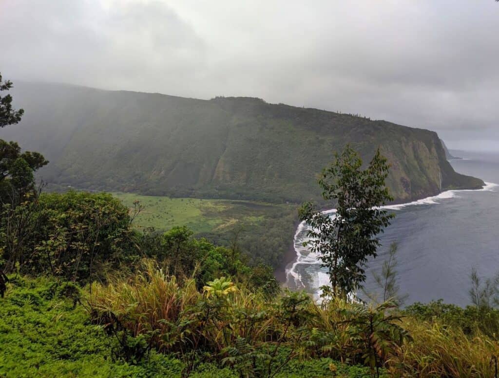 view of waipio valley from the lookout on a cloudy day
