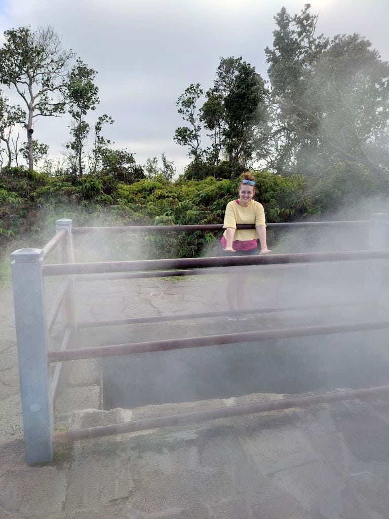 Me warming my hands over the Steam Vents, safely behind the fence over the hole in ground