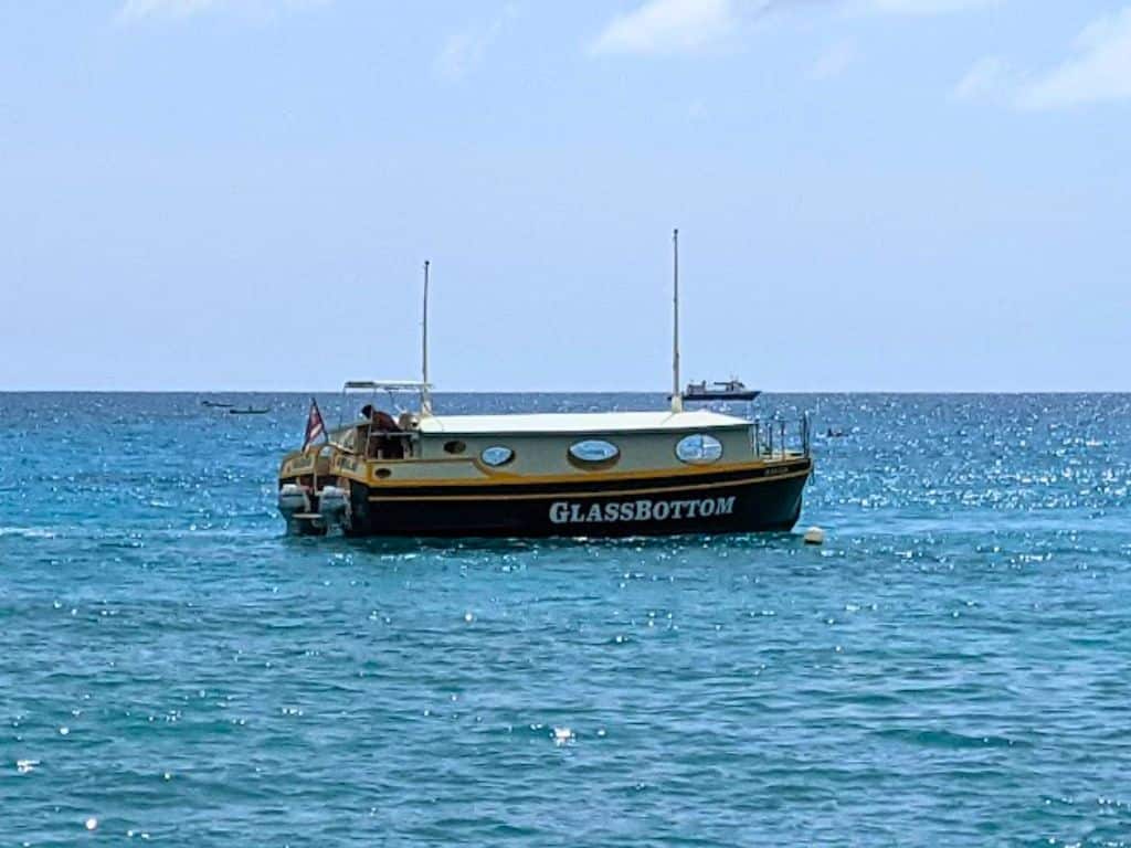 Kona Glass Bottom Boat in the ocean with other boats in background