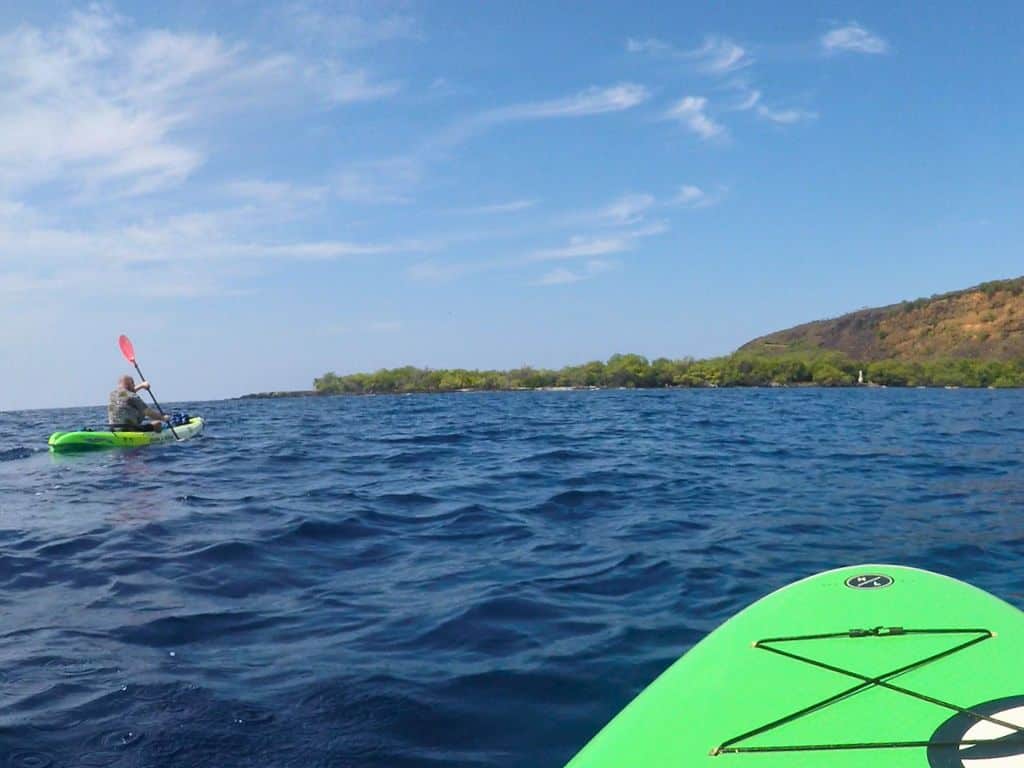 man Paddling kayak Kealakekua Bay
