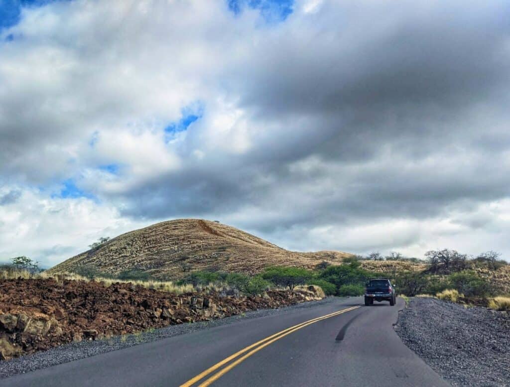 Pu'u Kuili hiking hill with road and truck in foreground