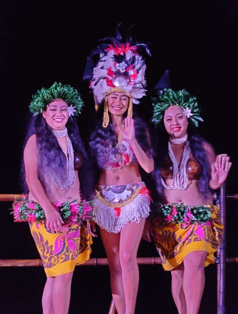 hula dancers standing and waving
