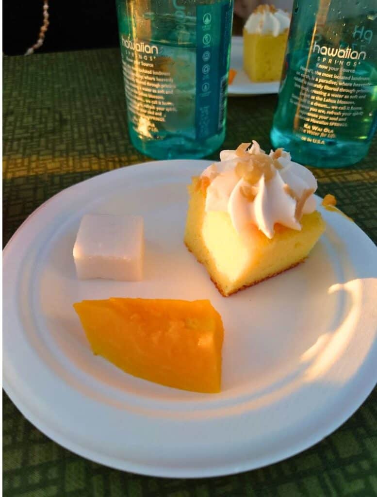 Dessert plate with three cake, haupia, and papaya