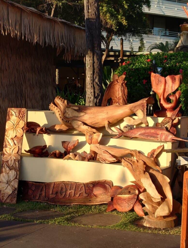 beautiful Woodcarvings on display and for sale. some are whales, flowers, and aloha signs