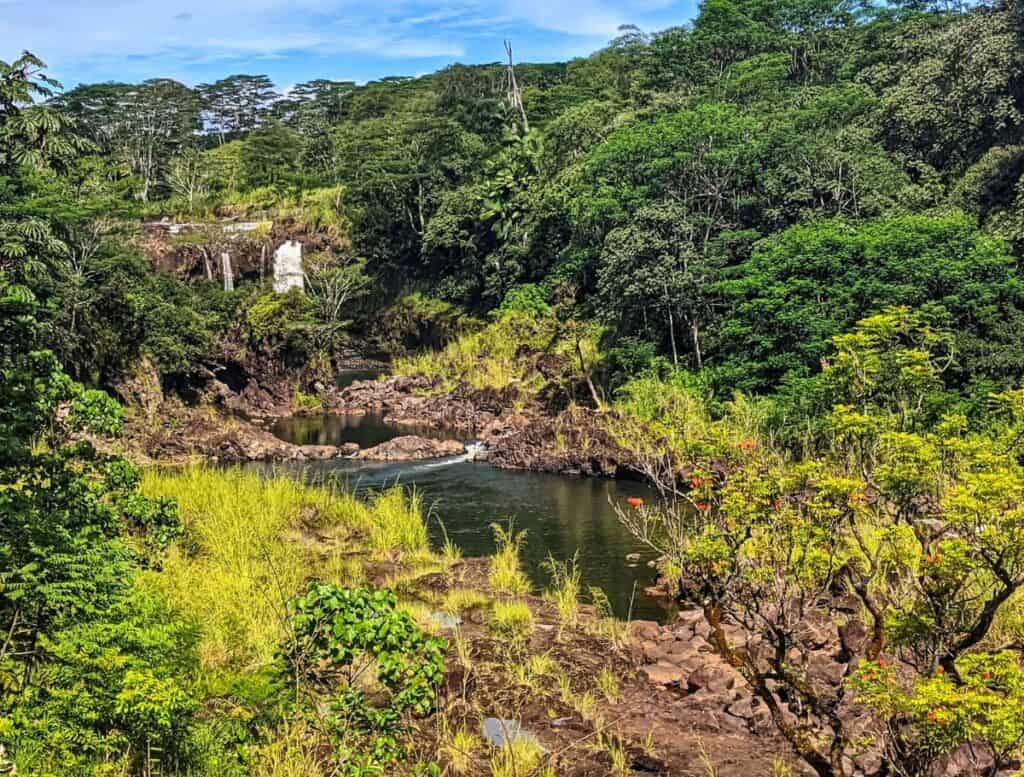 Pe'epe'e Waterfall hiding behind a rock and the river/Boiling Pots below