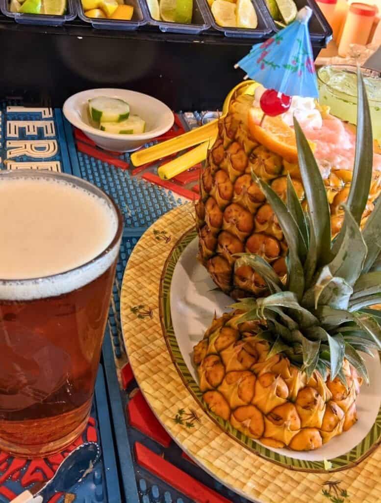 Fruity cocktail in a pineapple at Pineapples and cup of beer