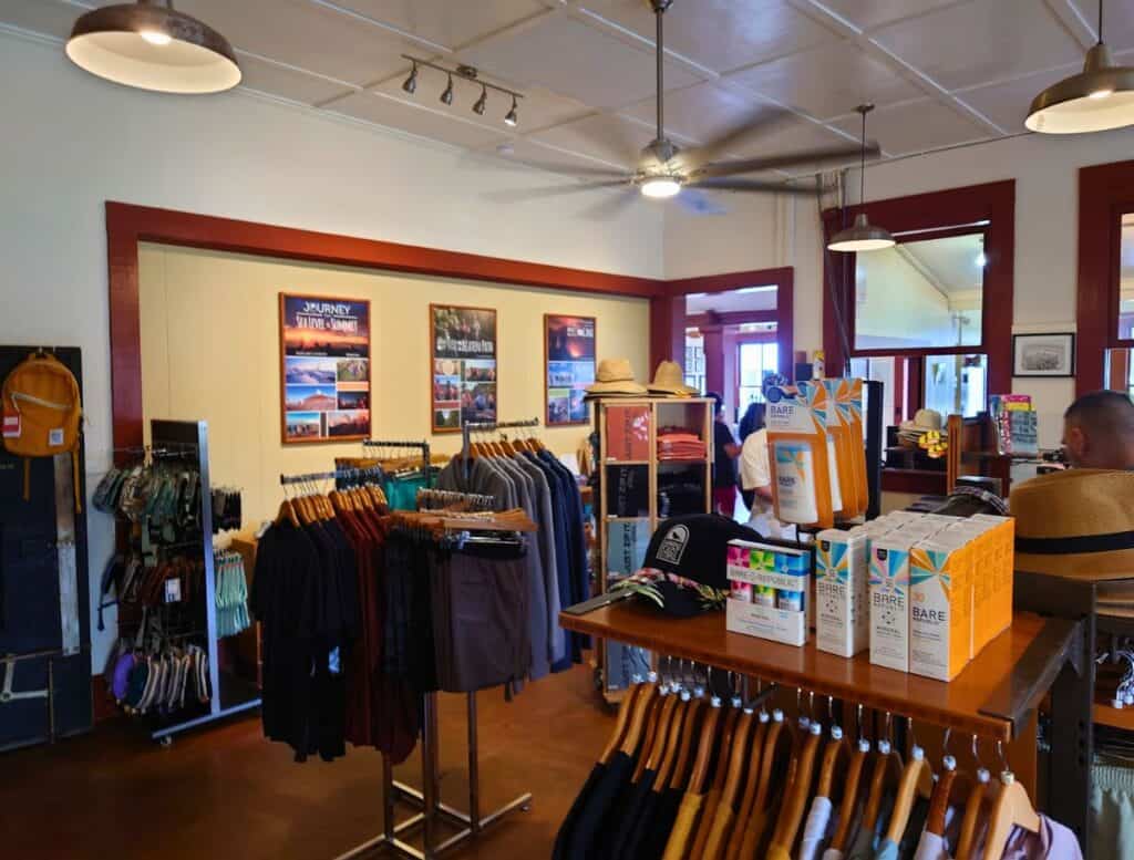 Kohala Zipline gift shop with outdoor clothes and gear on hangers