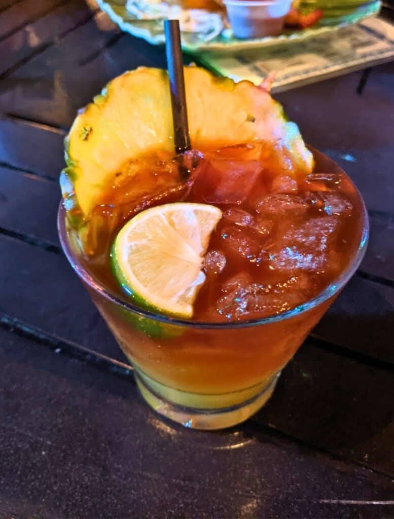 Huggo's Famous Mai Tai at On the Rocks with large pineapple wedge in the drink