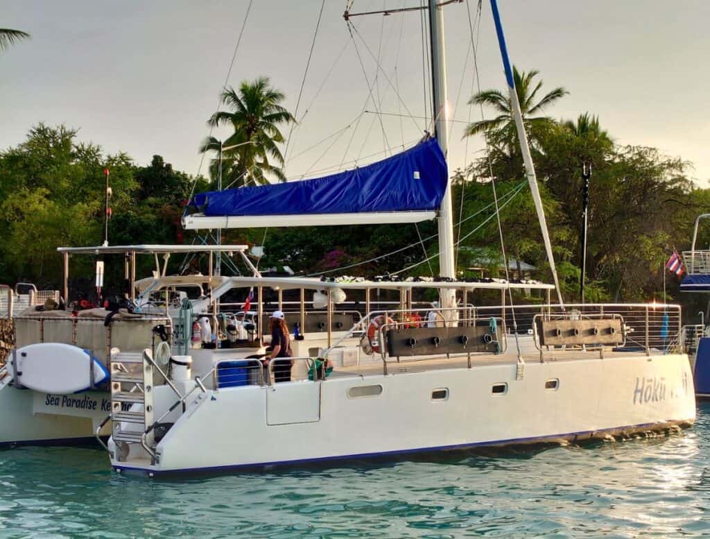 Sea Paradise's Hoku Nui catamaran, a white boat with sailing mast