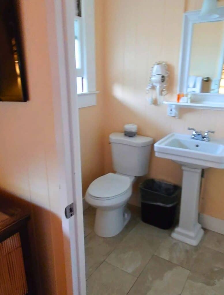 First floor bathroom with toilet and pedastal sink