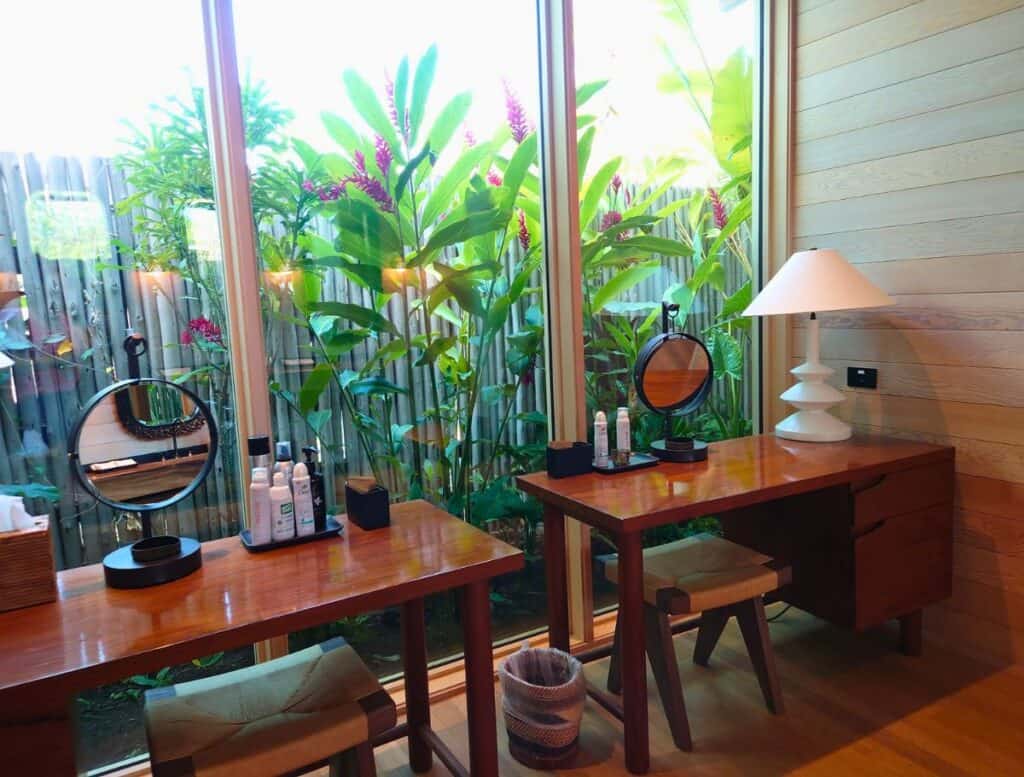 spa makeup tables with window looking into garden area
