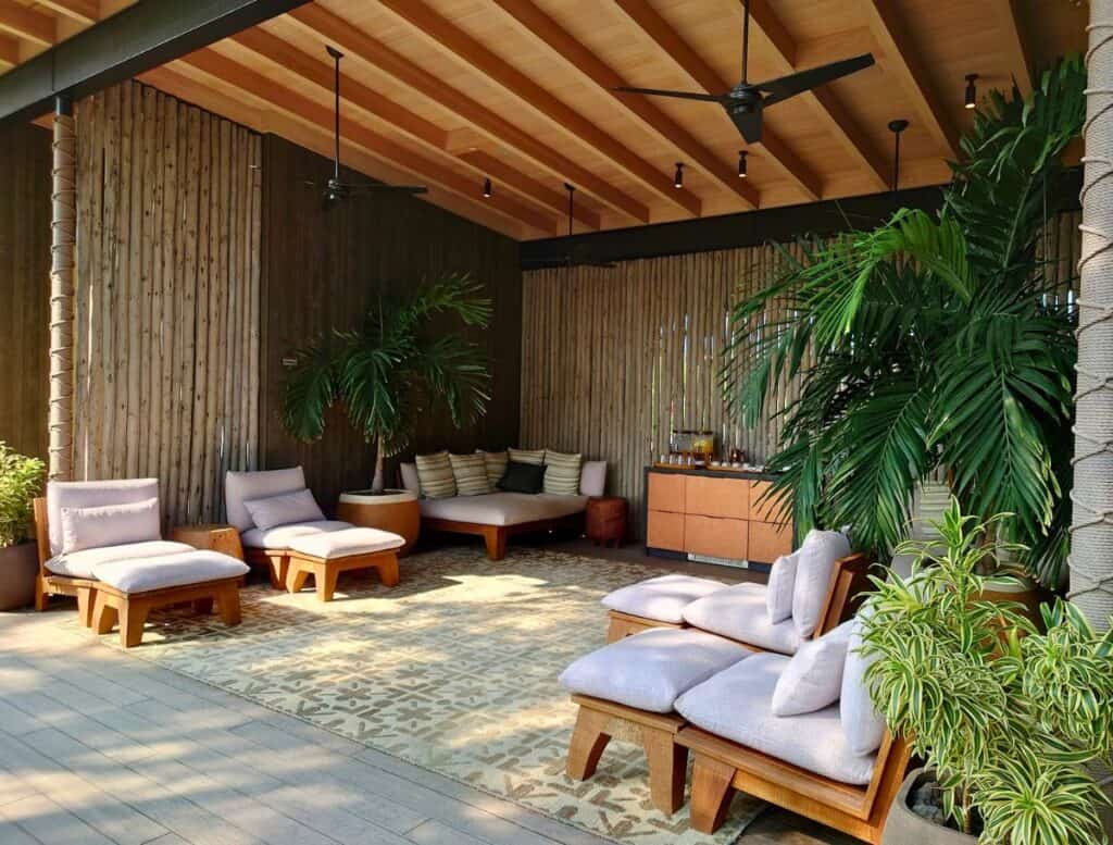 outdoor lounge area with chairs and couches