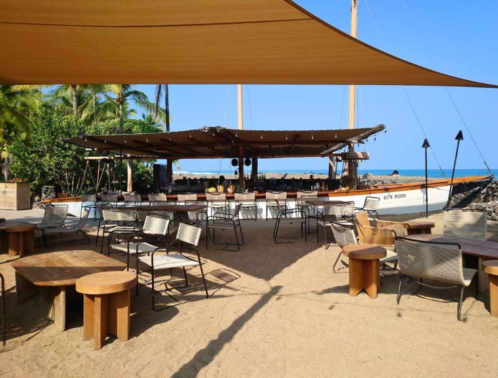 bar made from wooden sail boat and covered seating nearby