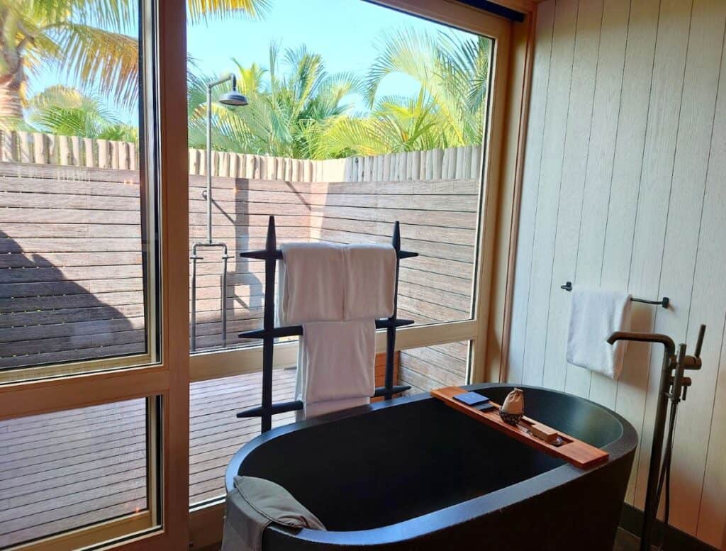 Mountain View Two Bedroom Kauhale stone tube and outdoor shower