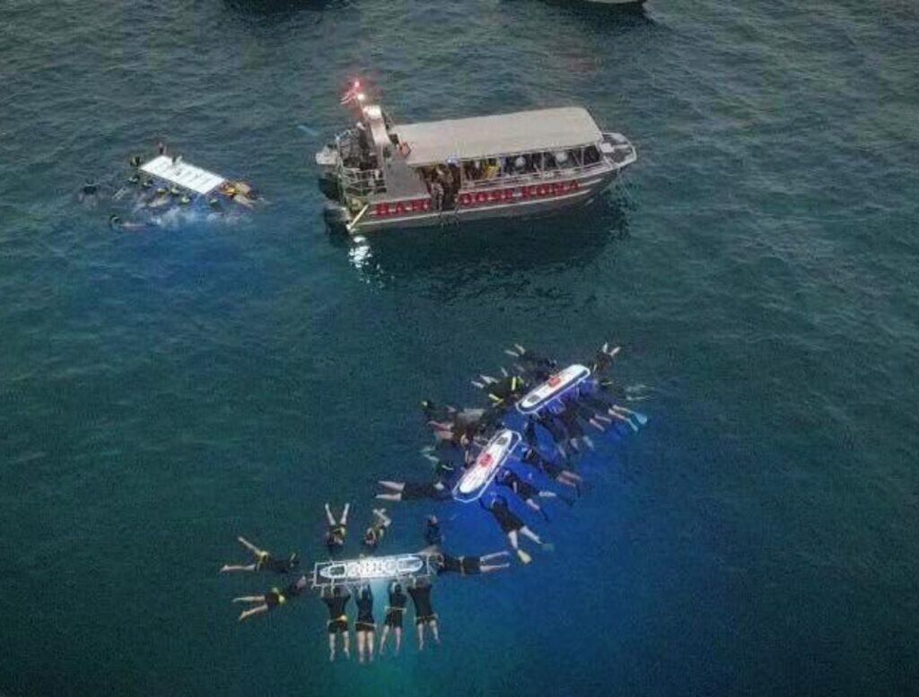 aerial view of Hang Loose boat & snorkelers on float boards in ocean
photo credit: Hang Loose