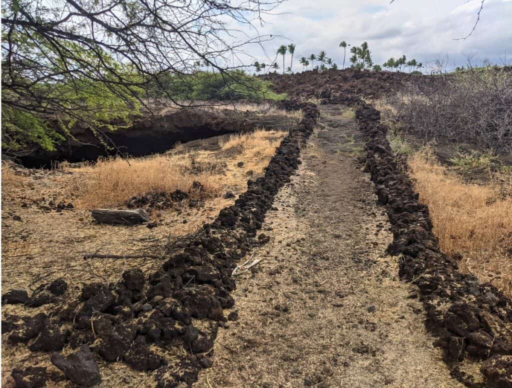 lava rock lined Kings Trail from Kalahuipua’a Historic Park trail