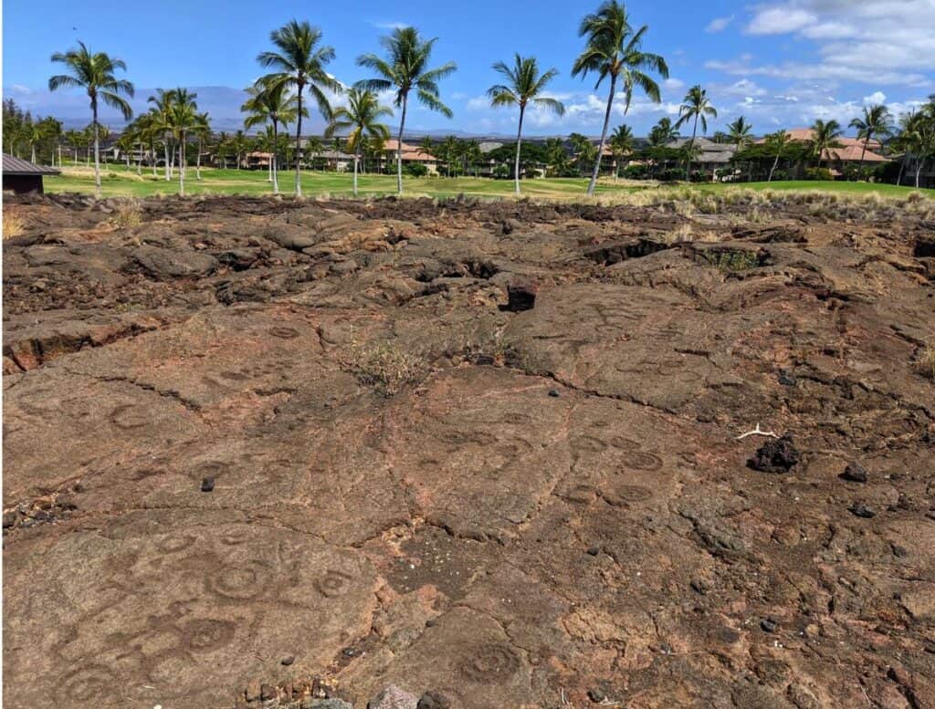 Waikoloa Petroglyph Reserve field with golf course in background