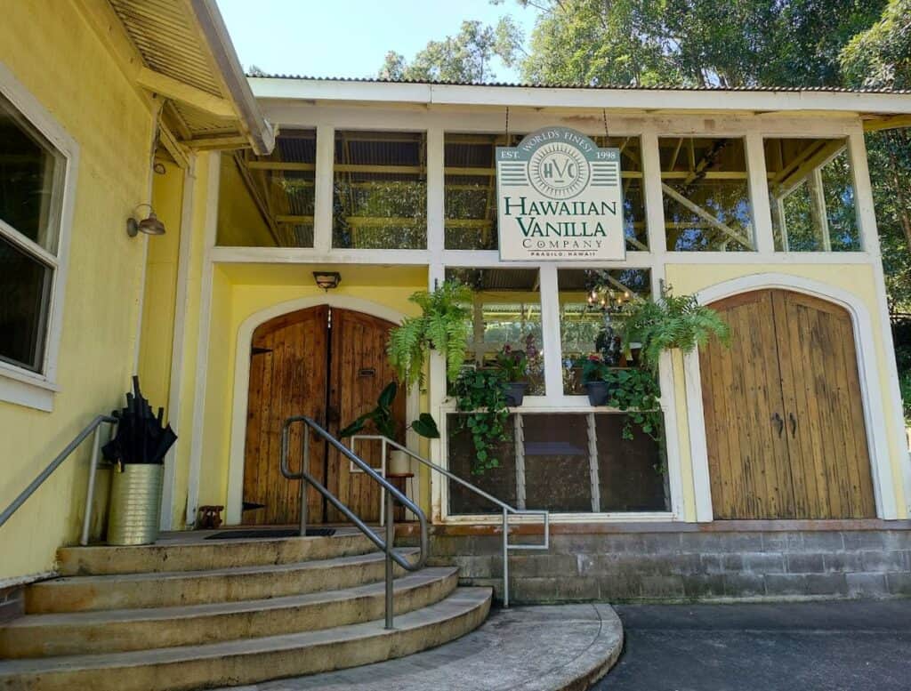 Hawaiian Vanilla Co entrance with yellow exterior and large wooden doors