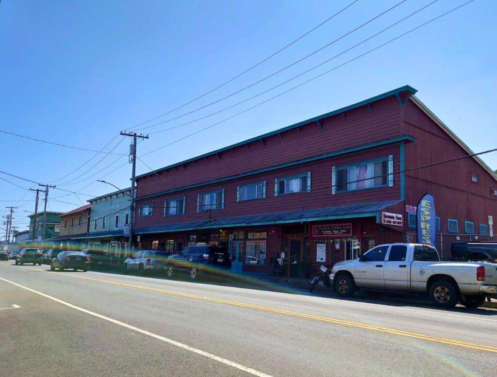 Downtown Honoka'a with old west-type buidlings and parallel parked cars