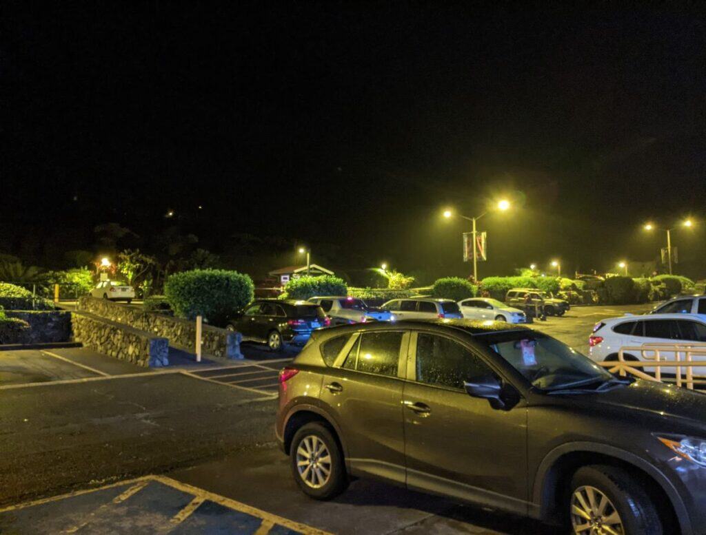 dim yellow lights at night in a parking lot