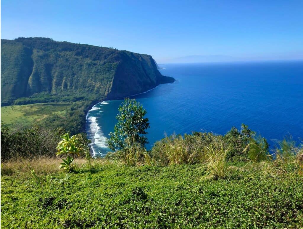 Waipio Valley Lookout with blue ocean and scky and maui in the background